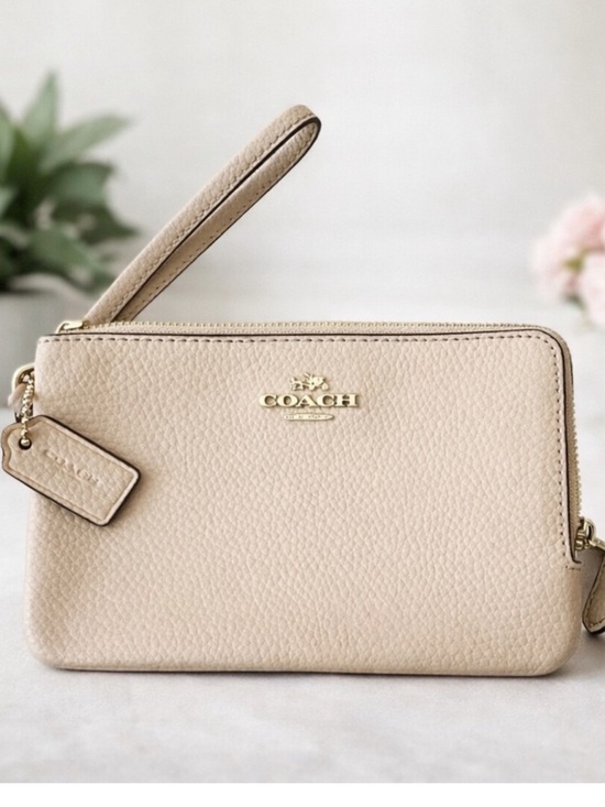 Coach Handbags - Luxurious Coach Beige Wristlet in Pebbled Leather With Gold Hardware
